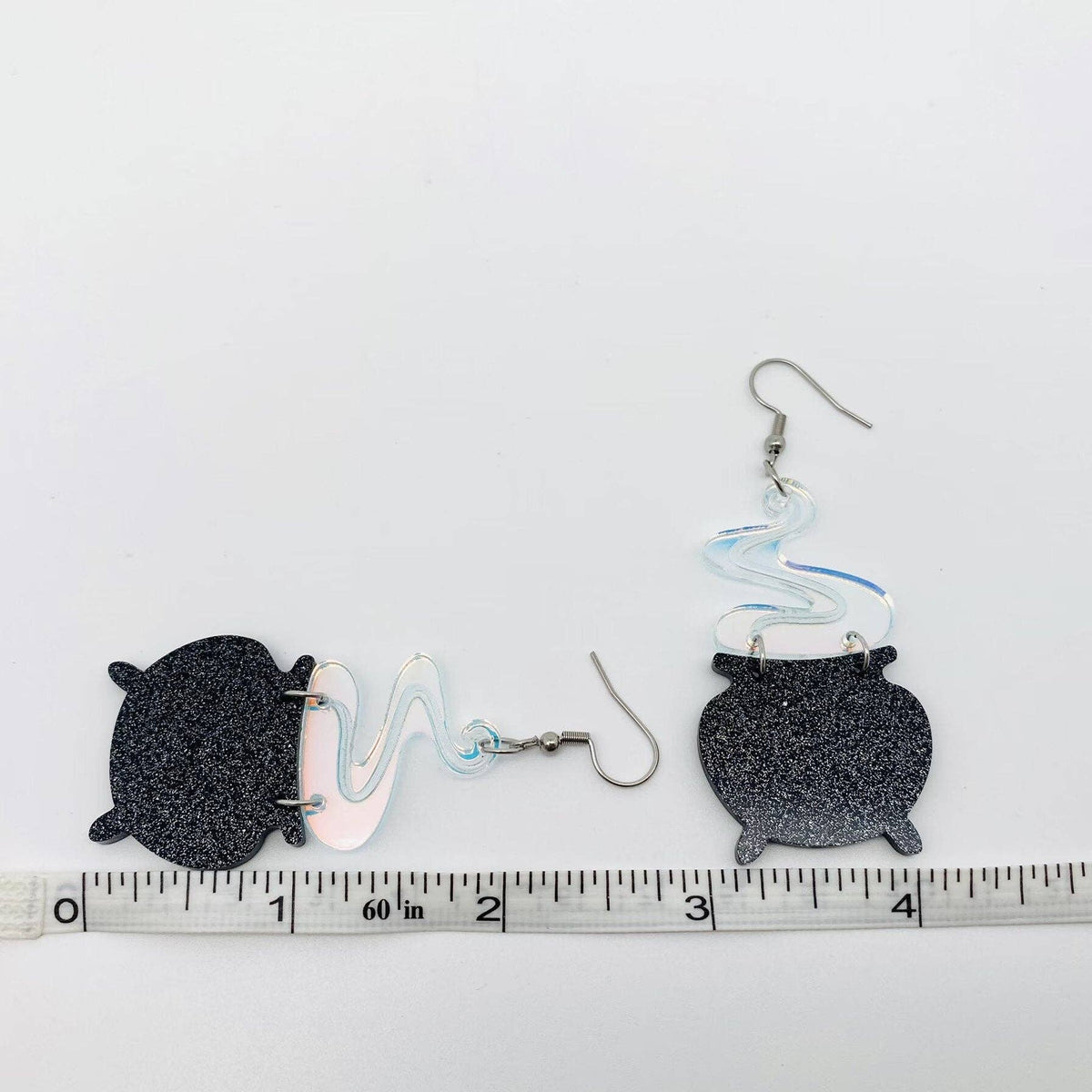 
                  
                    Iridescent Acrylic Cauldron Earrings
                  
                