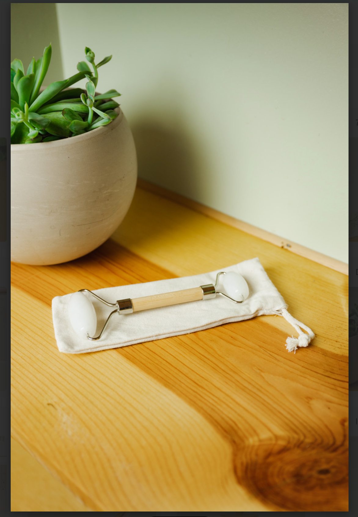 
                  
                    Stone + Bamboo Facial Massage Roller
                  
                