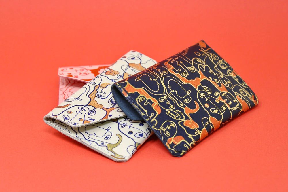 Many Faces Leather Popper Purse