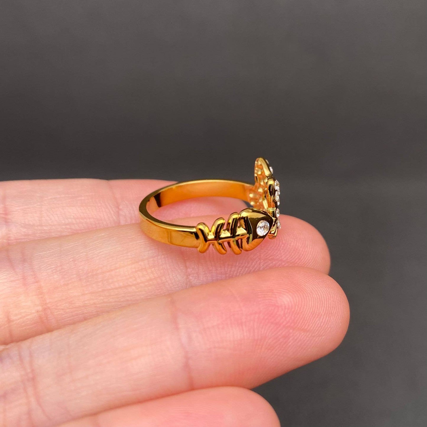 
                  
                    Zircon Inlaid Cat Meets Fish Ring
                  
                
