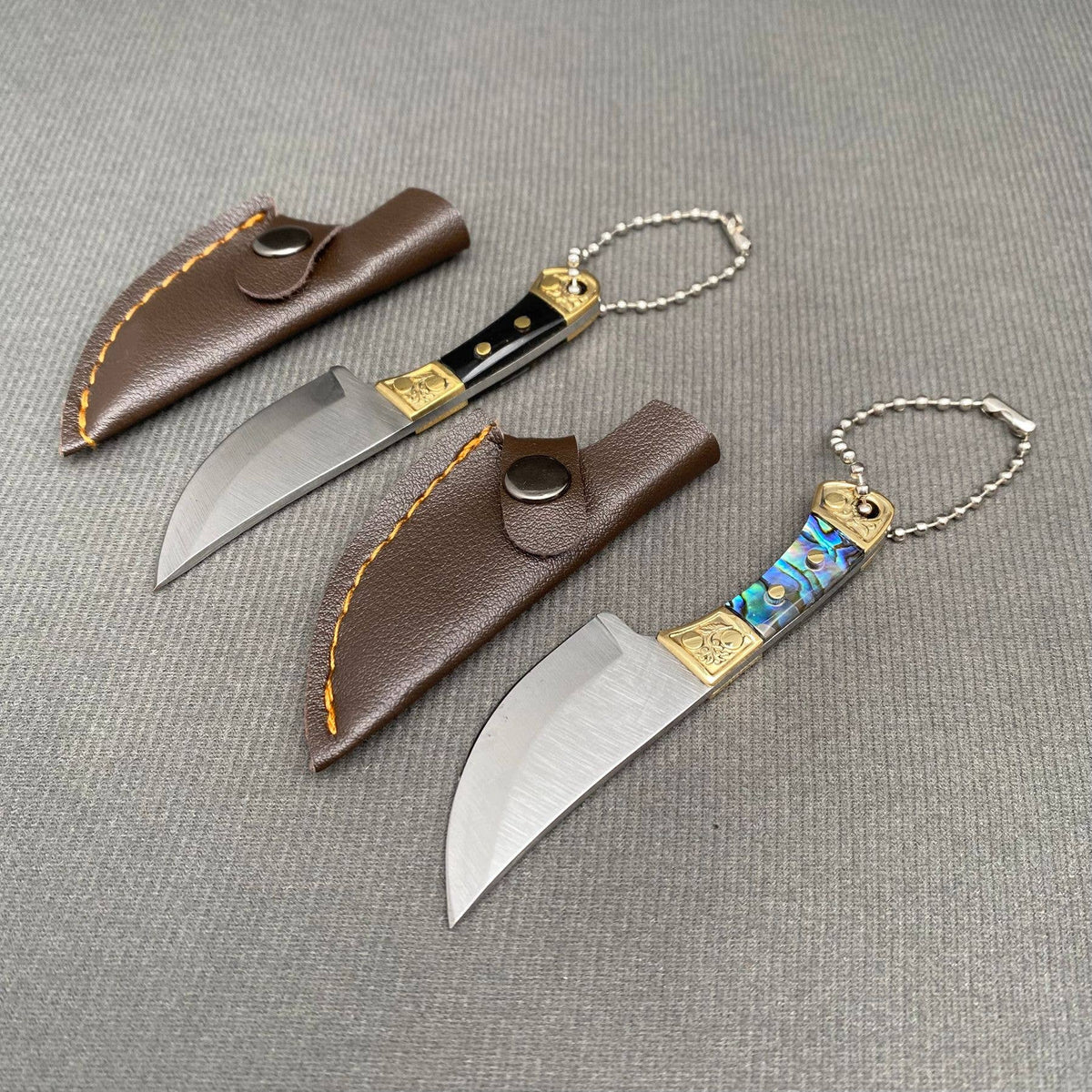 
                  
                    Mini Knife with Protective Sheath
                  
                