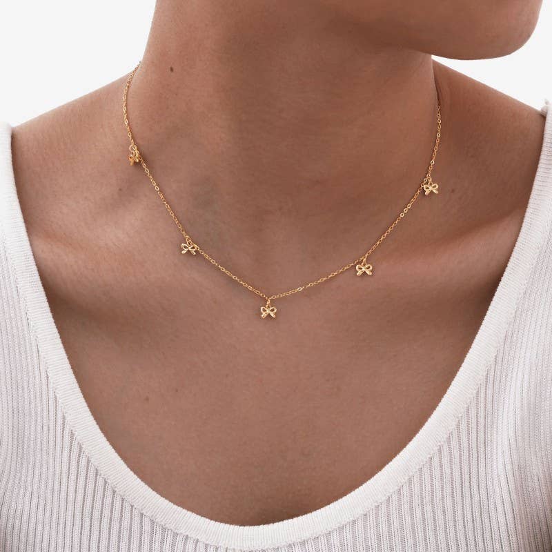 
                  
                    String of Bows Gold Necklace
                  
                