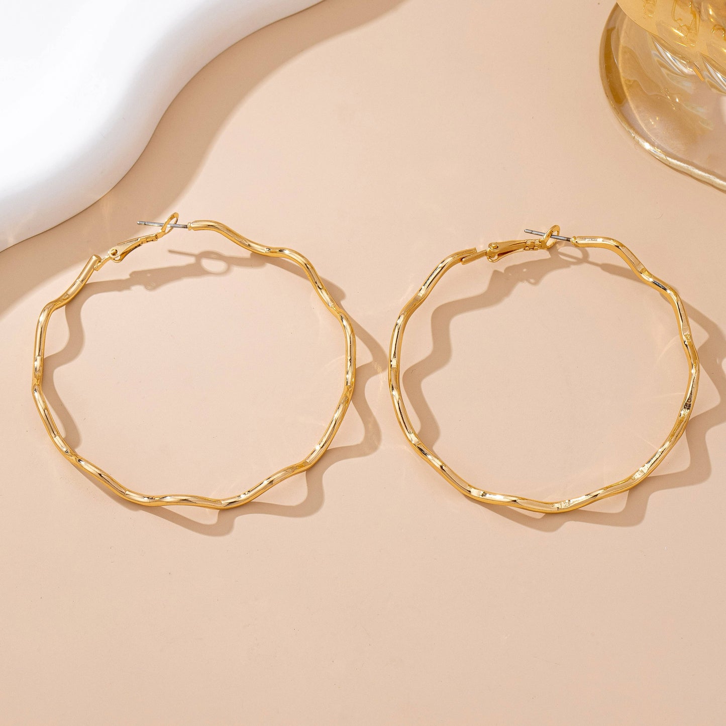
                  
                    Hammered Closed Hoop Wavy Earrings
                  
                