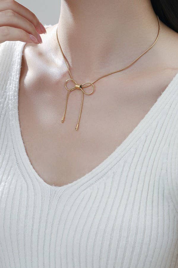 
                  
                    Gold Bow Cable Necklace
                  
                