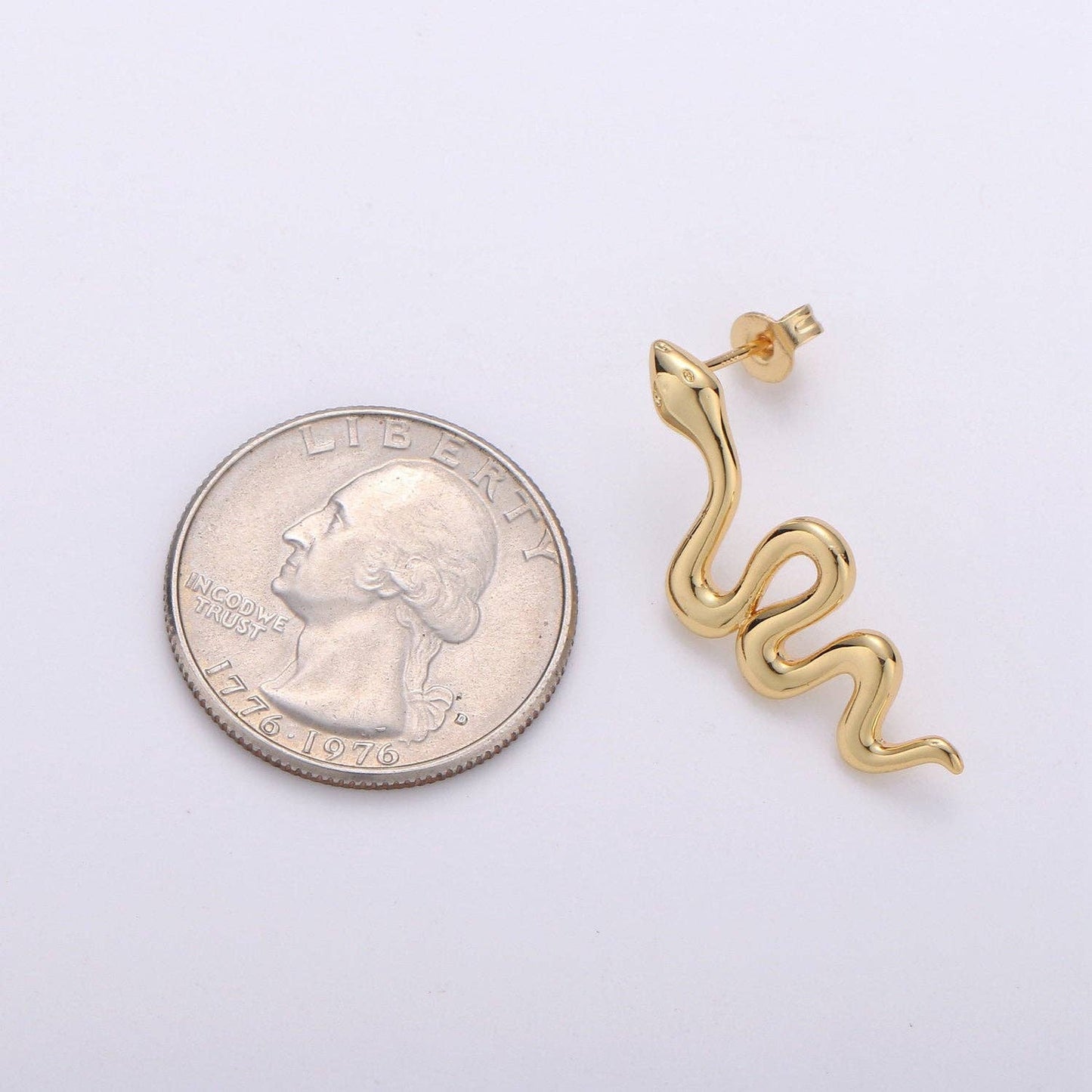 
                  
                    Gold Snake Studs
                  
                