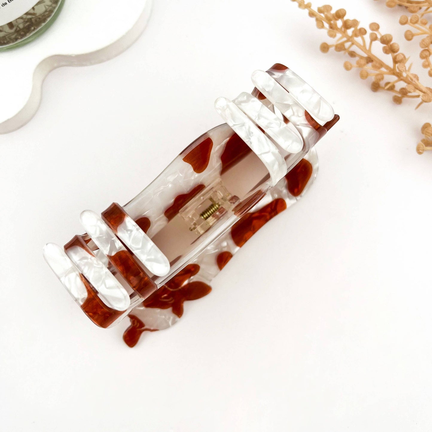 
                  
                    Brown and White Cow Claw
                  
                