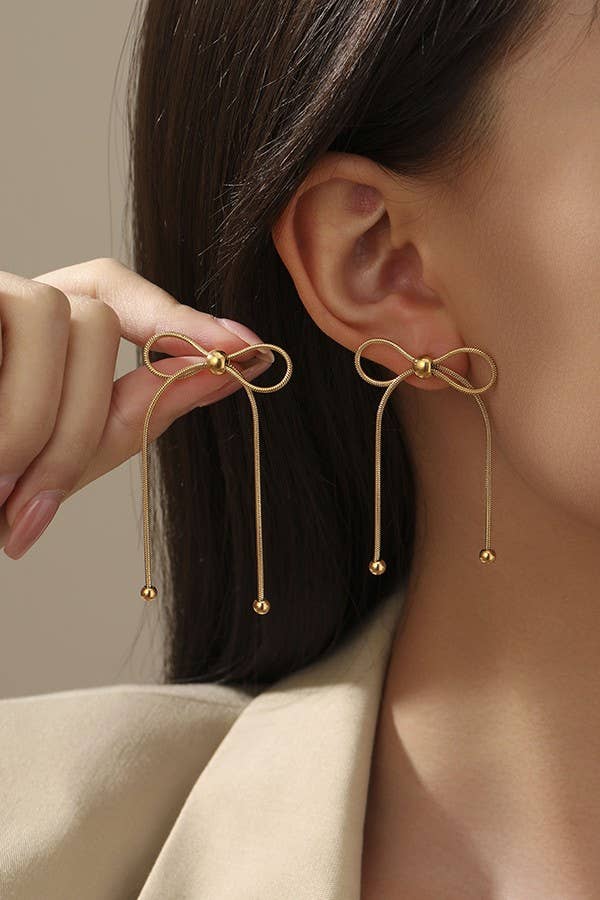 
                  
                    Silver Bow Movement Earrings
                  
                