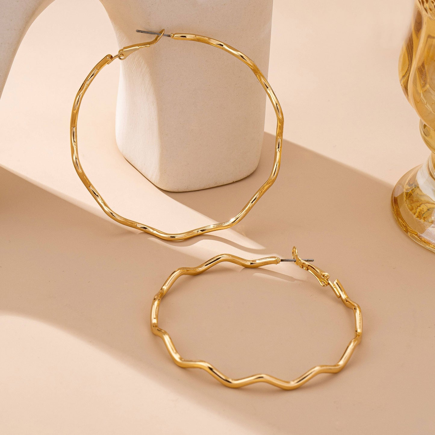 
                  
                    Hammered Closed Hoop Wavy Earrings
                  
                