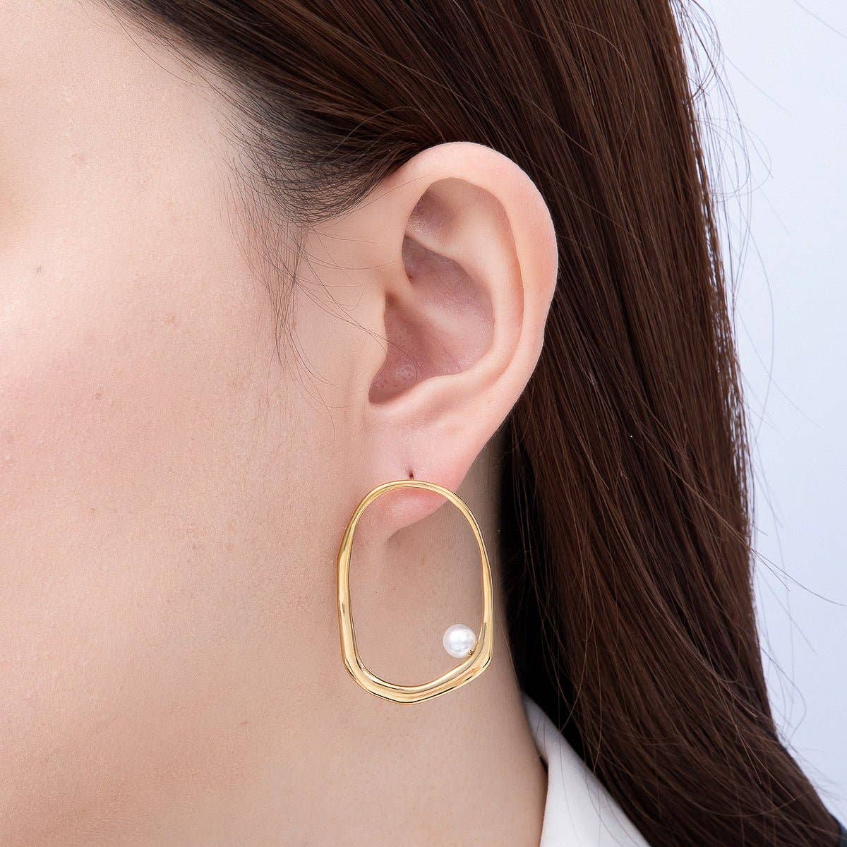 
                  
                    Organic Oblong Cradled Pearl Earrings
                  
                
