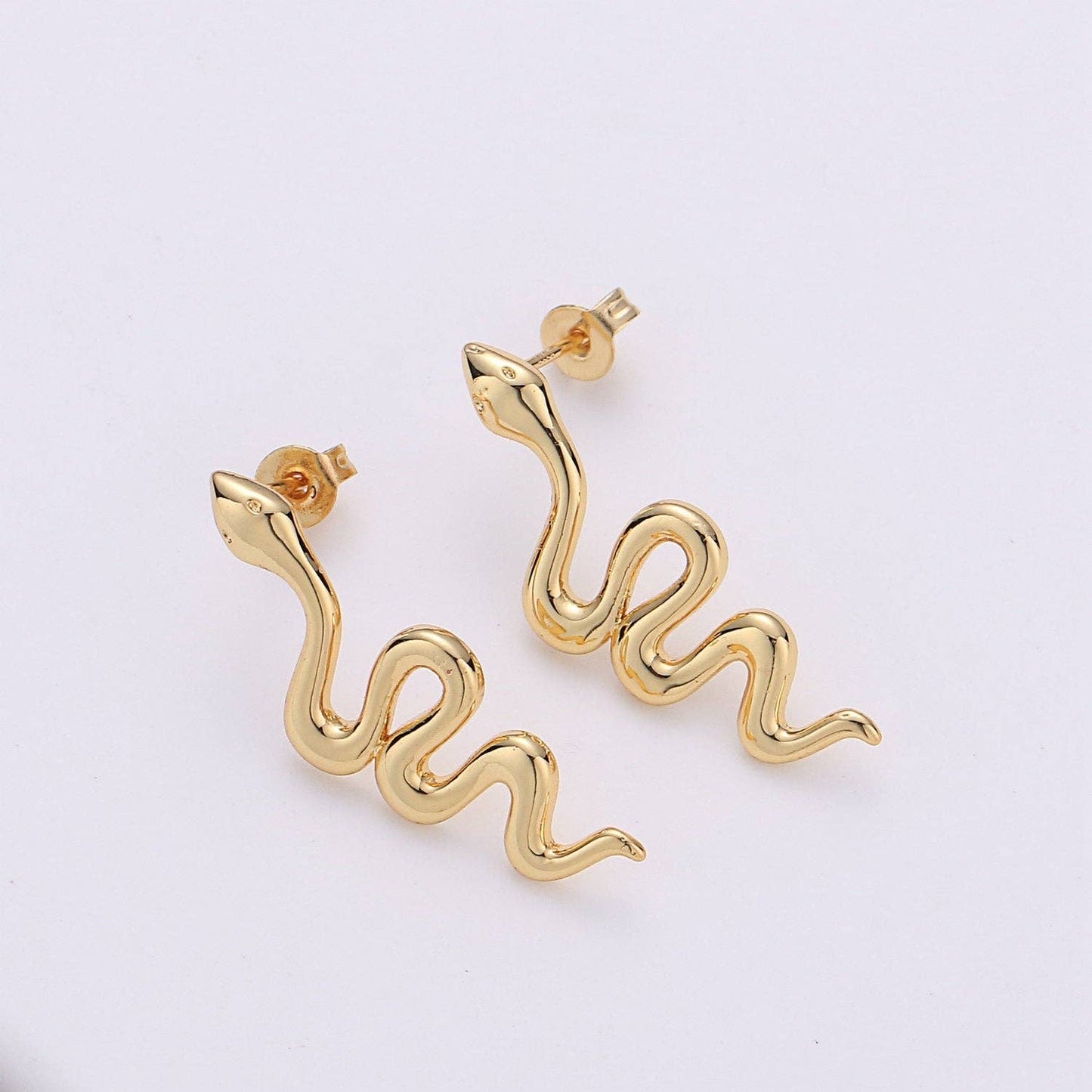 
                  
                    Gold Snake Studs
                  
                