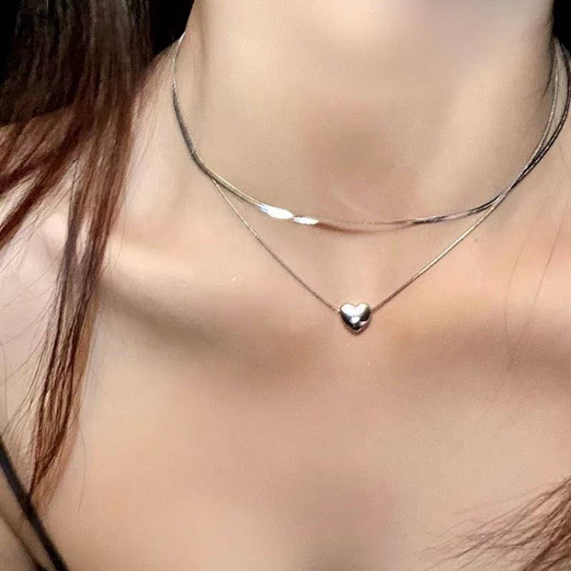 
                  
                    Silver Heart Necklace Stack
                  
                