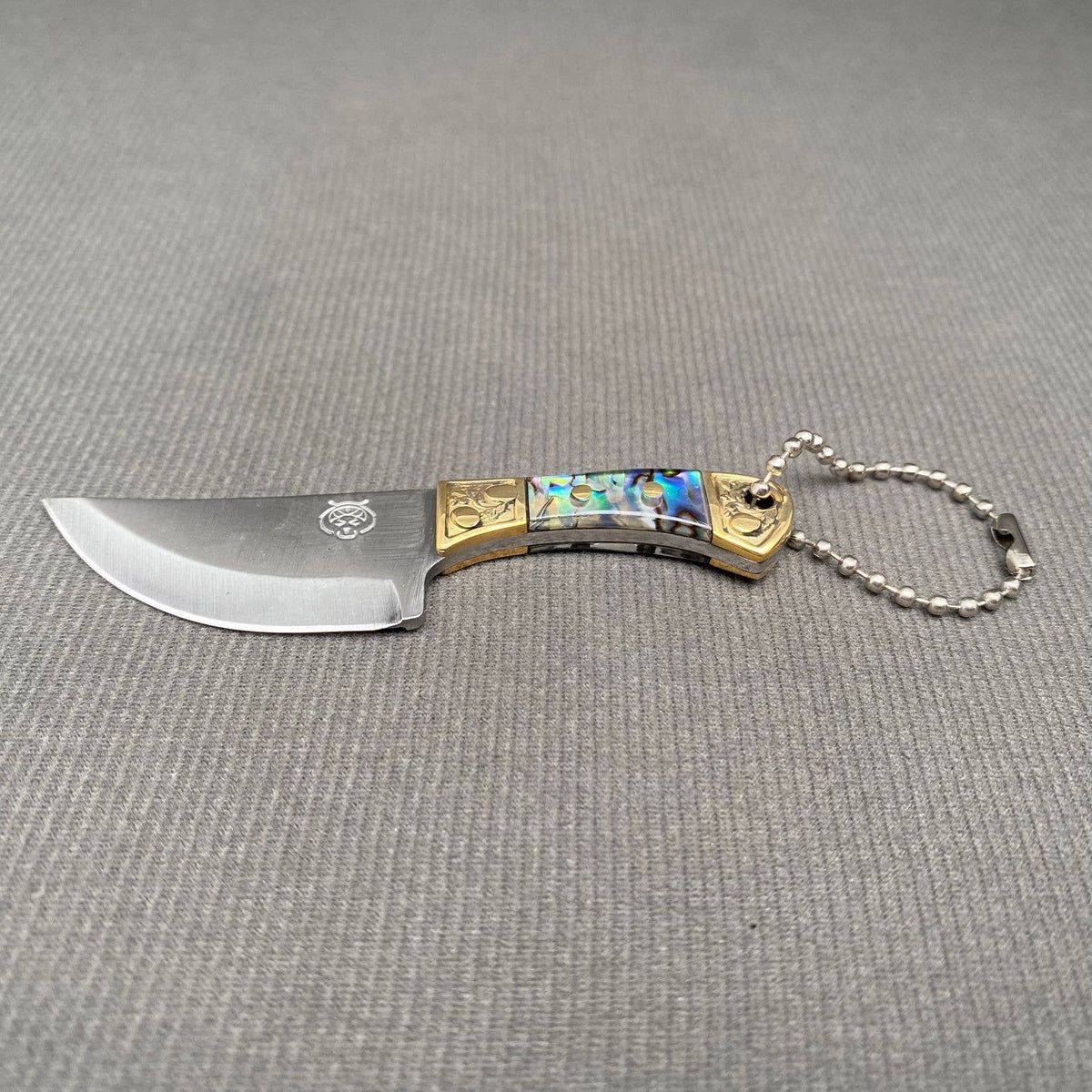 
                  
                    Mini Knife with Protective Sheath
                  
                