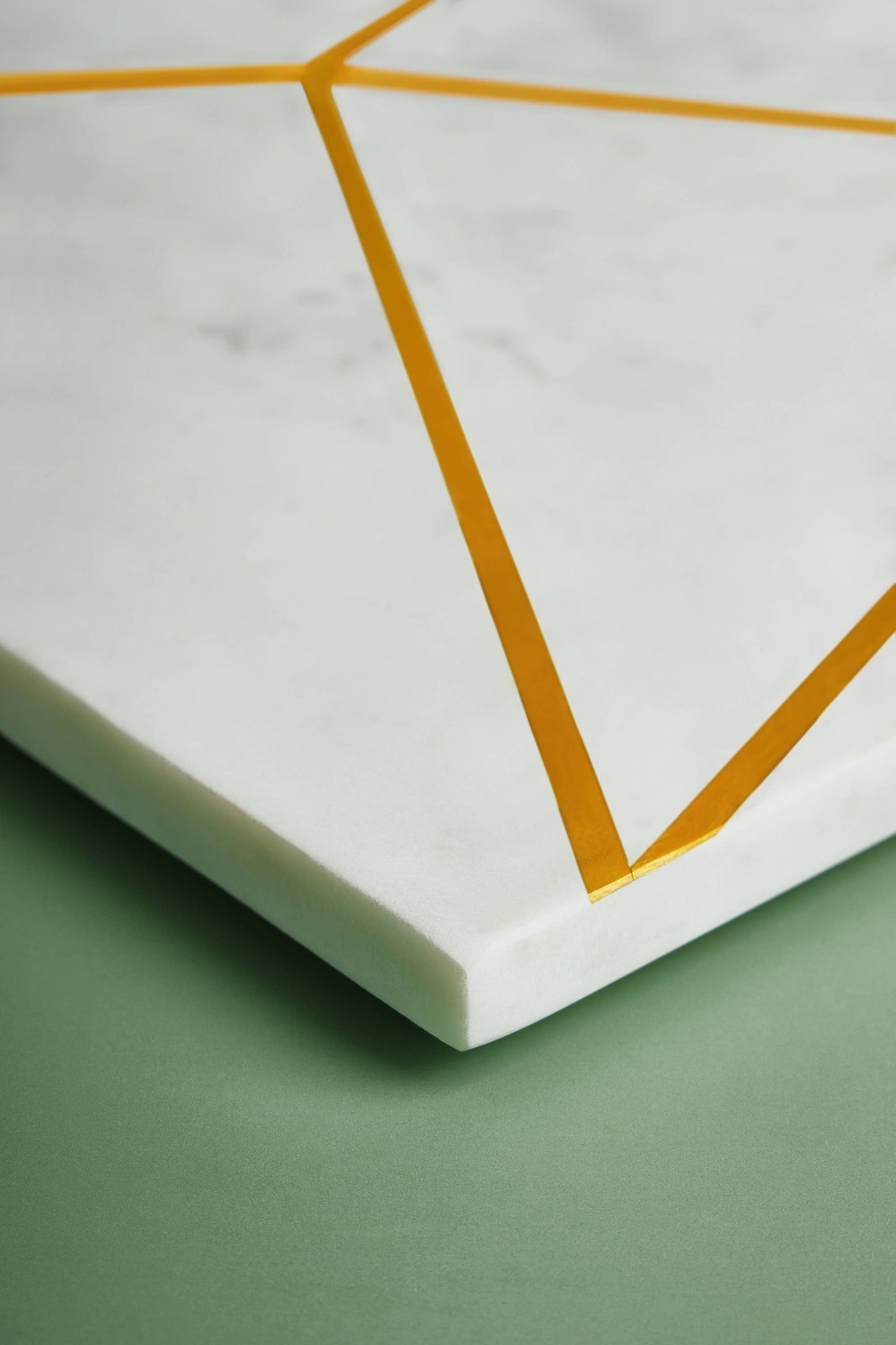 
                  
                    Marble with Brass Inlay Geometric Paddle Cheeseboard
                  
                
