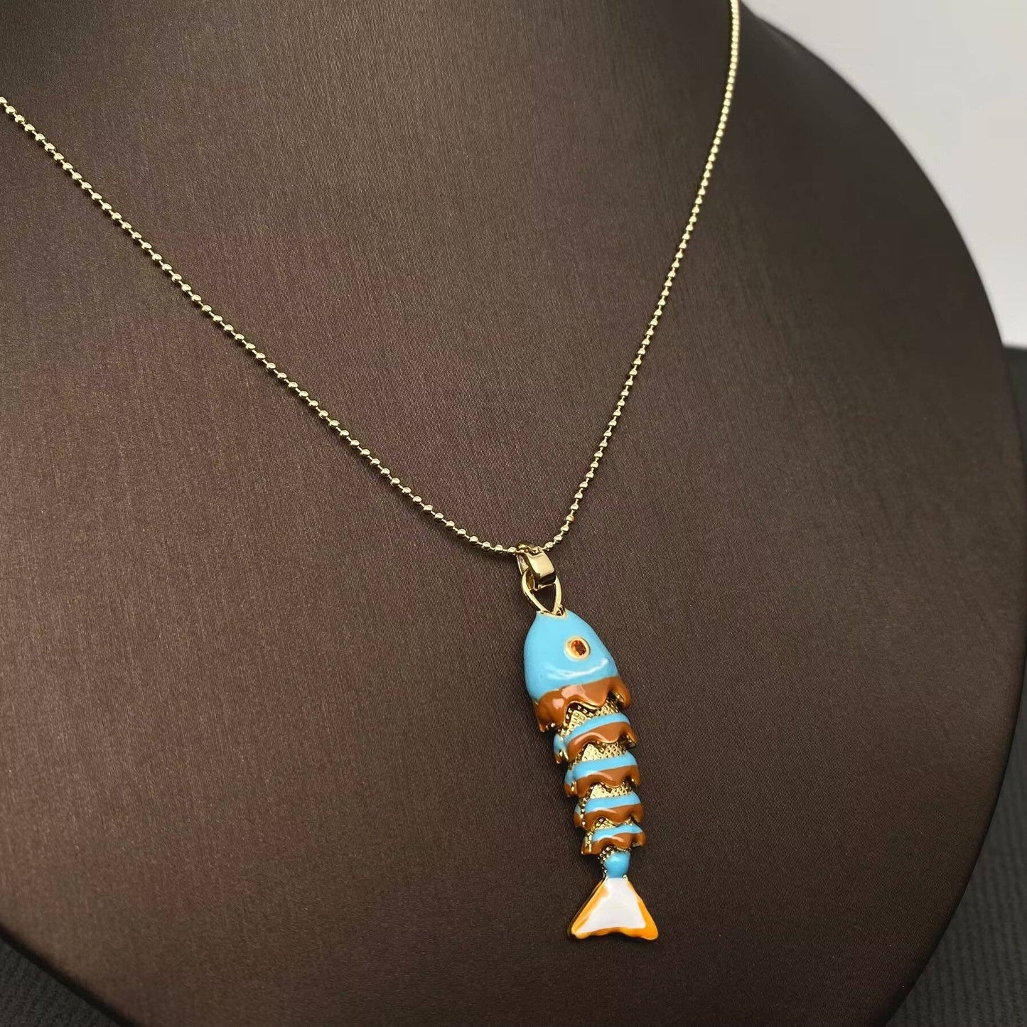 
                  
                    Enamel Wiggle Fish Necklace
                  
                