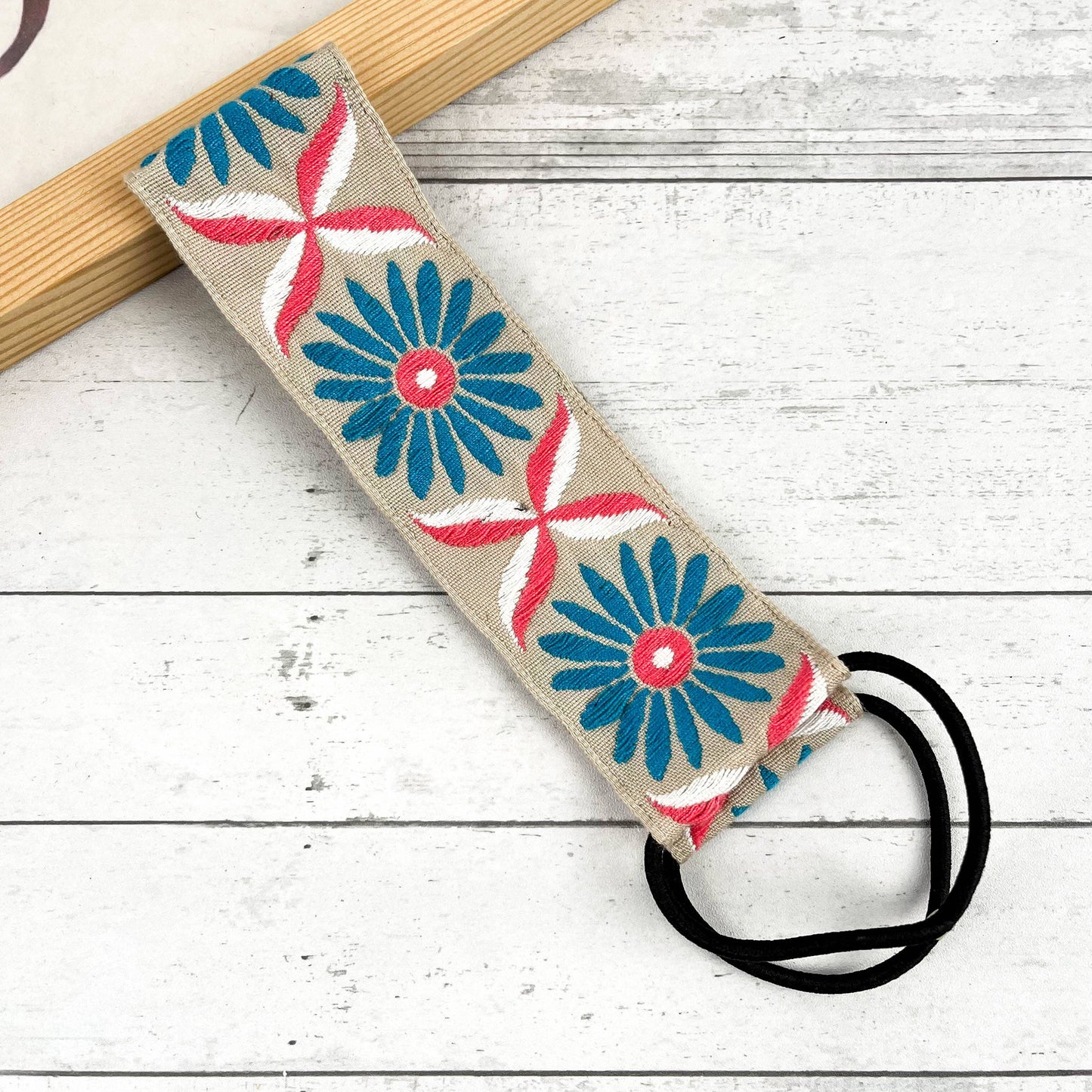 
                  
                    Embroidered Coneflower Knotted Headband
                  
                