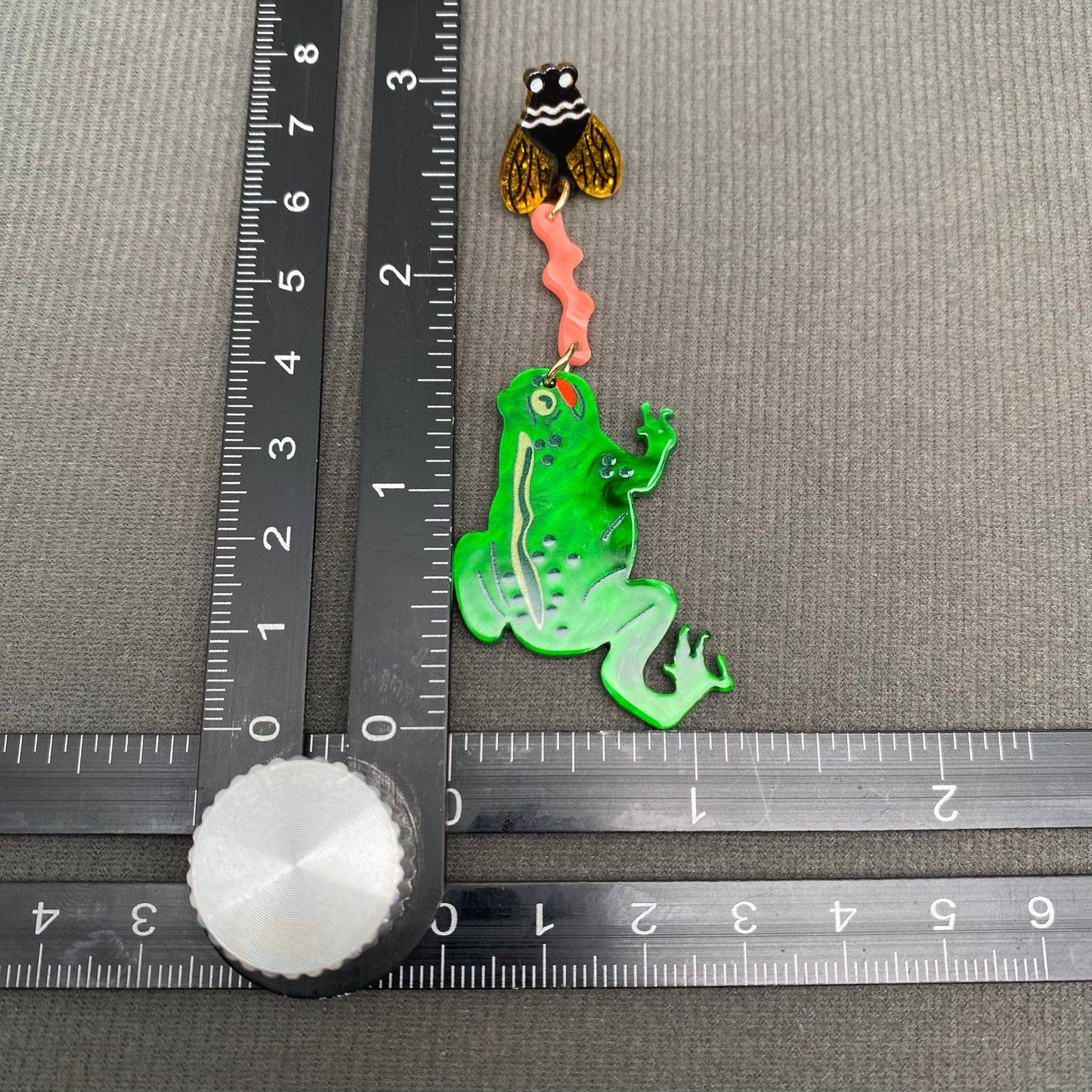 
                  
                    Acrylic Frog Eating Flies Earrings
                  
                