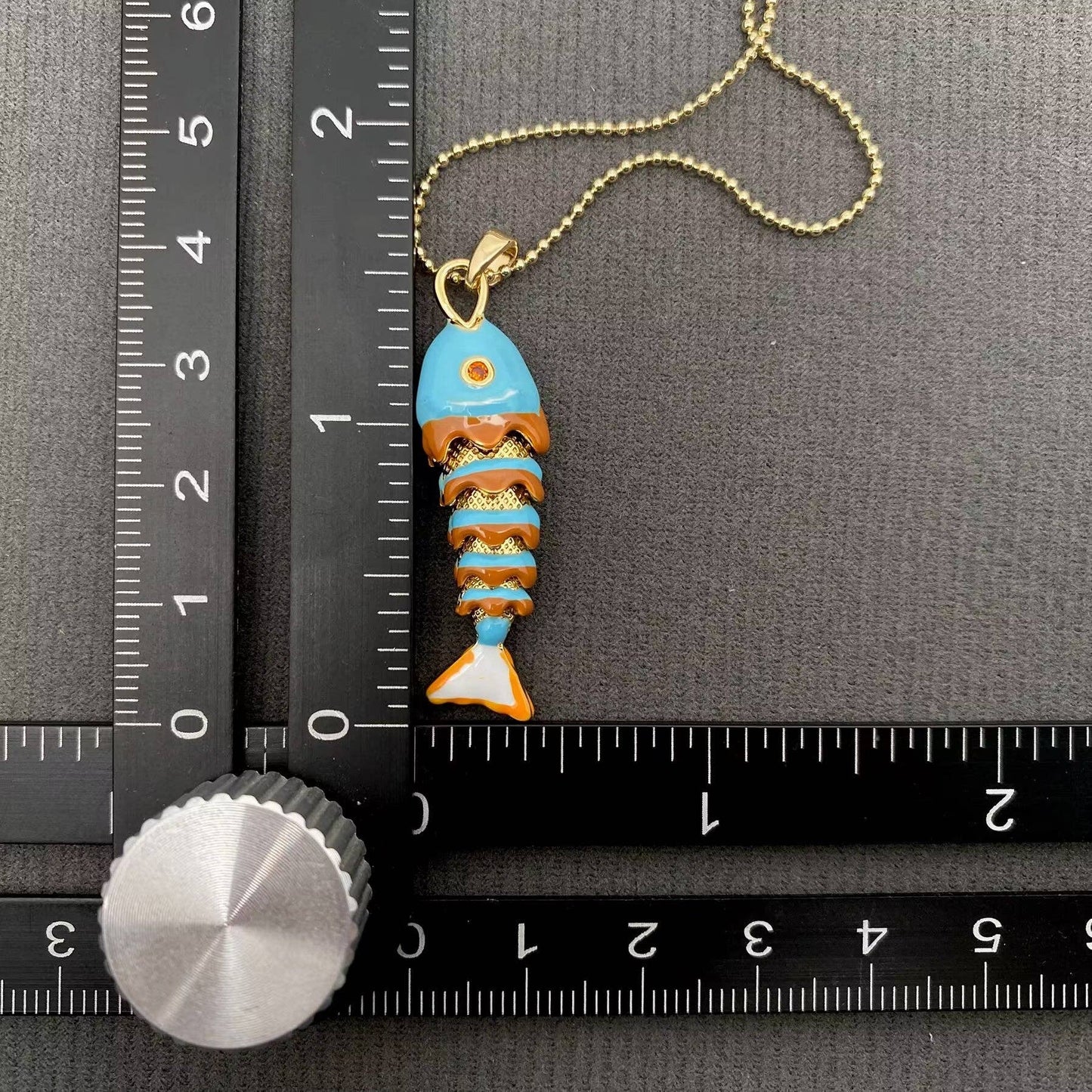 
                  
                    Enamel Wiggle Fish Necklace
                  
                