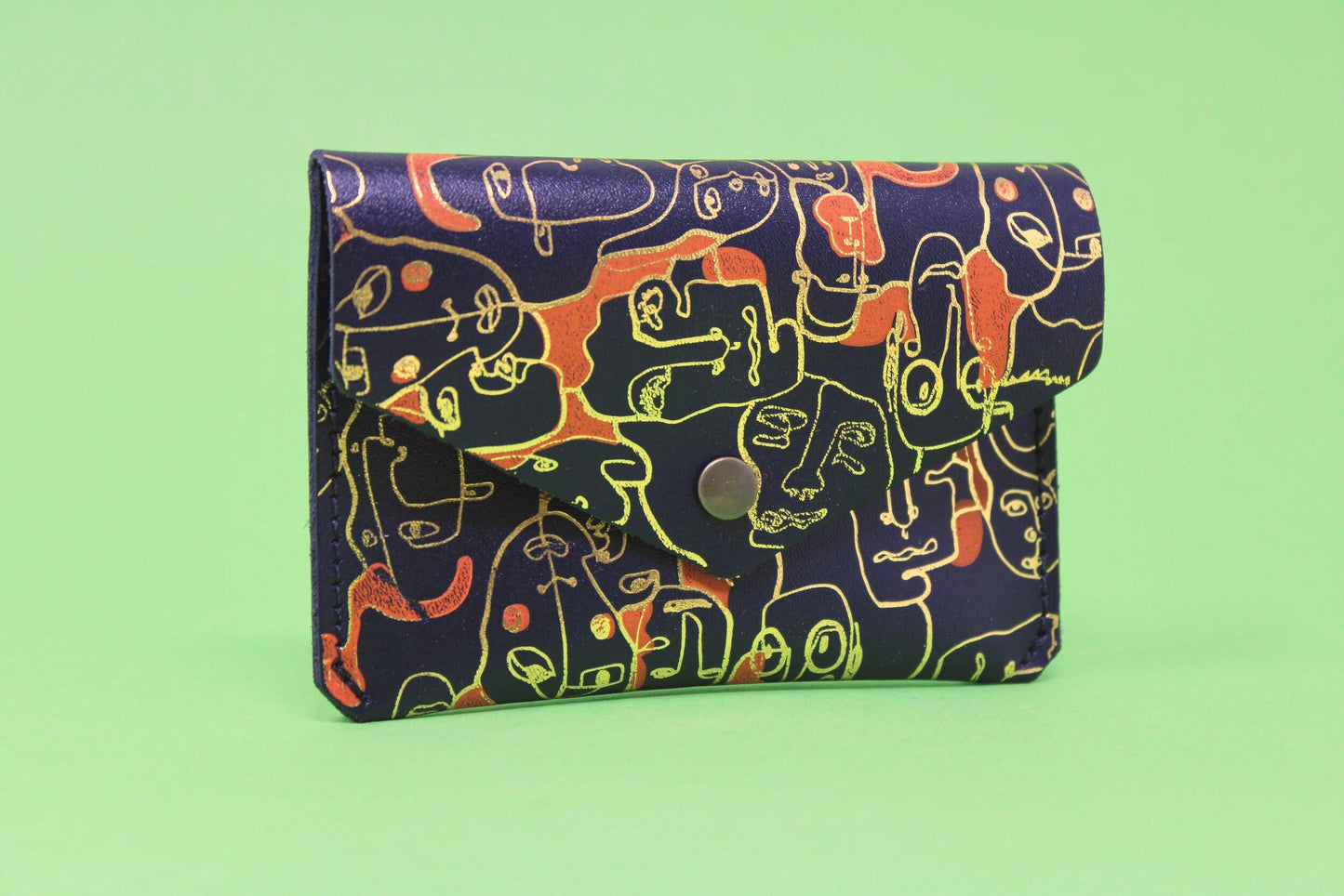 
                  
                    Many Faces Leather Popper Purse
                  
                