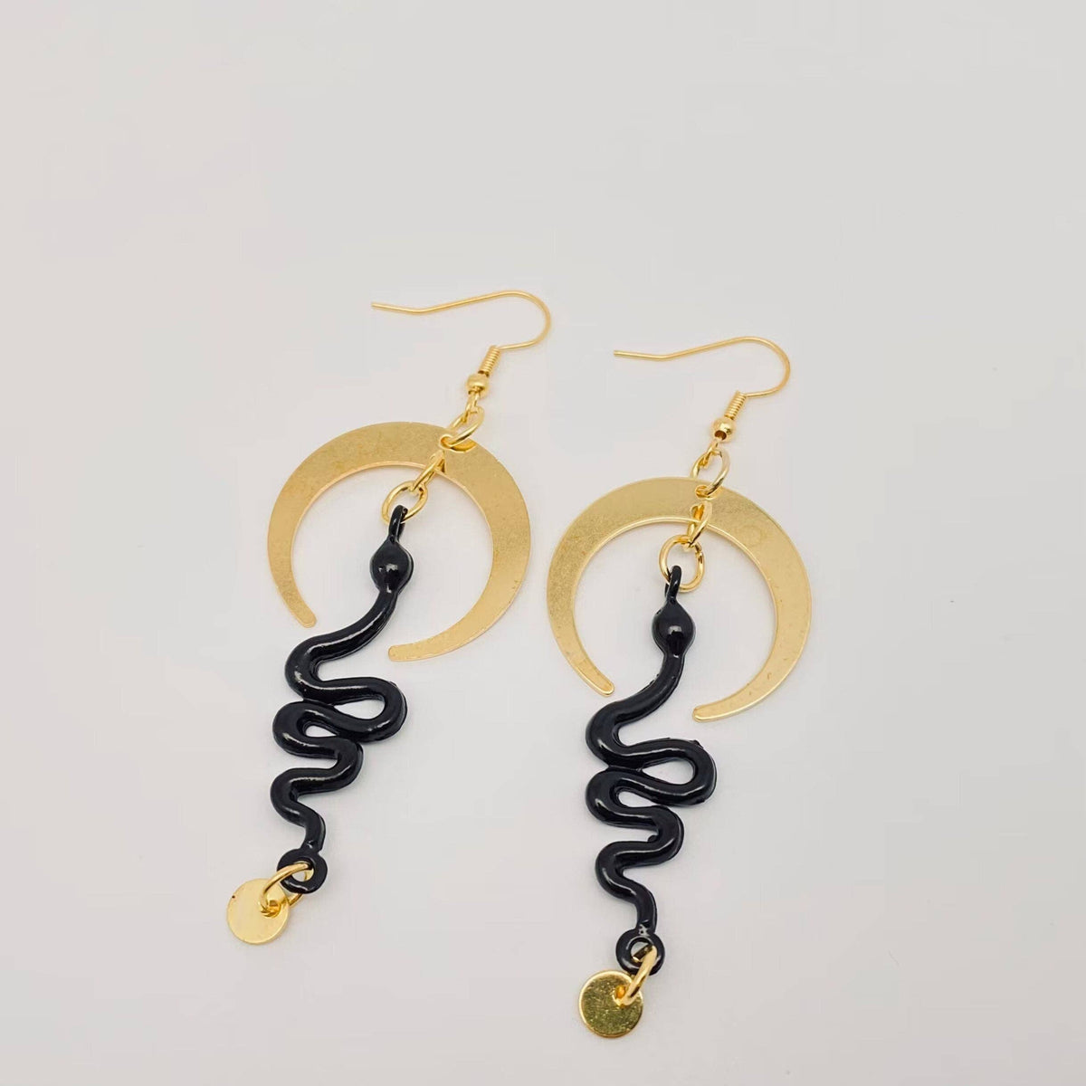 
                  
                    Nocterra Snake Earrings
                  
                