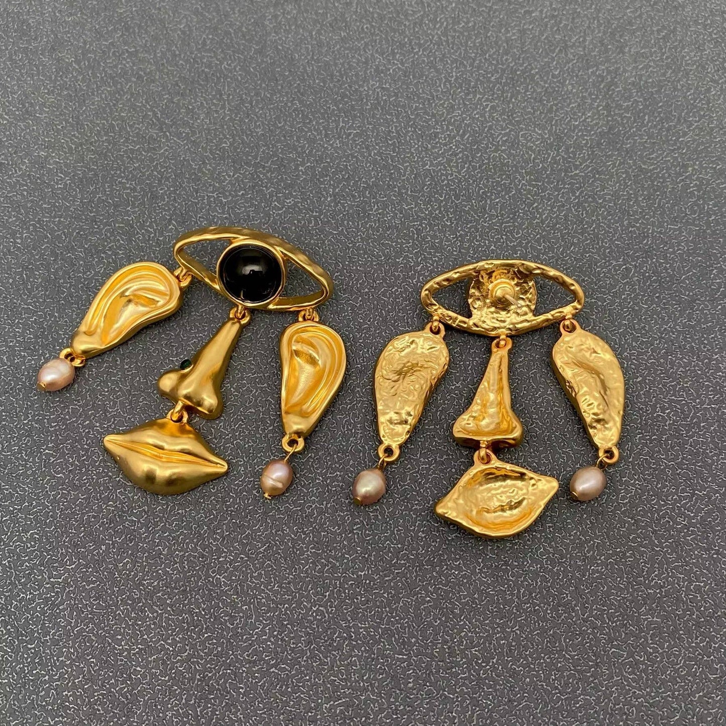 
                  
                    Abstract Face Dangle Earrings
                  
                