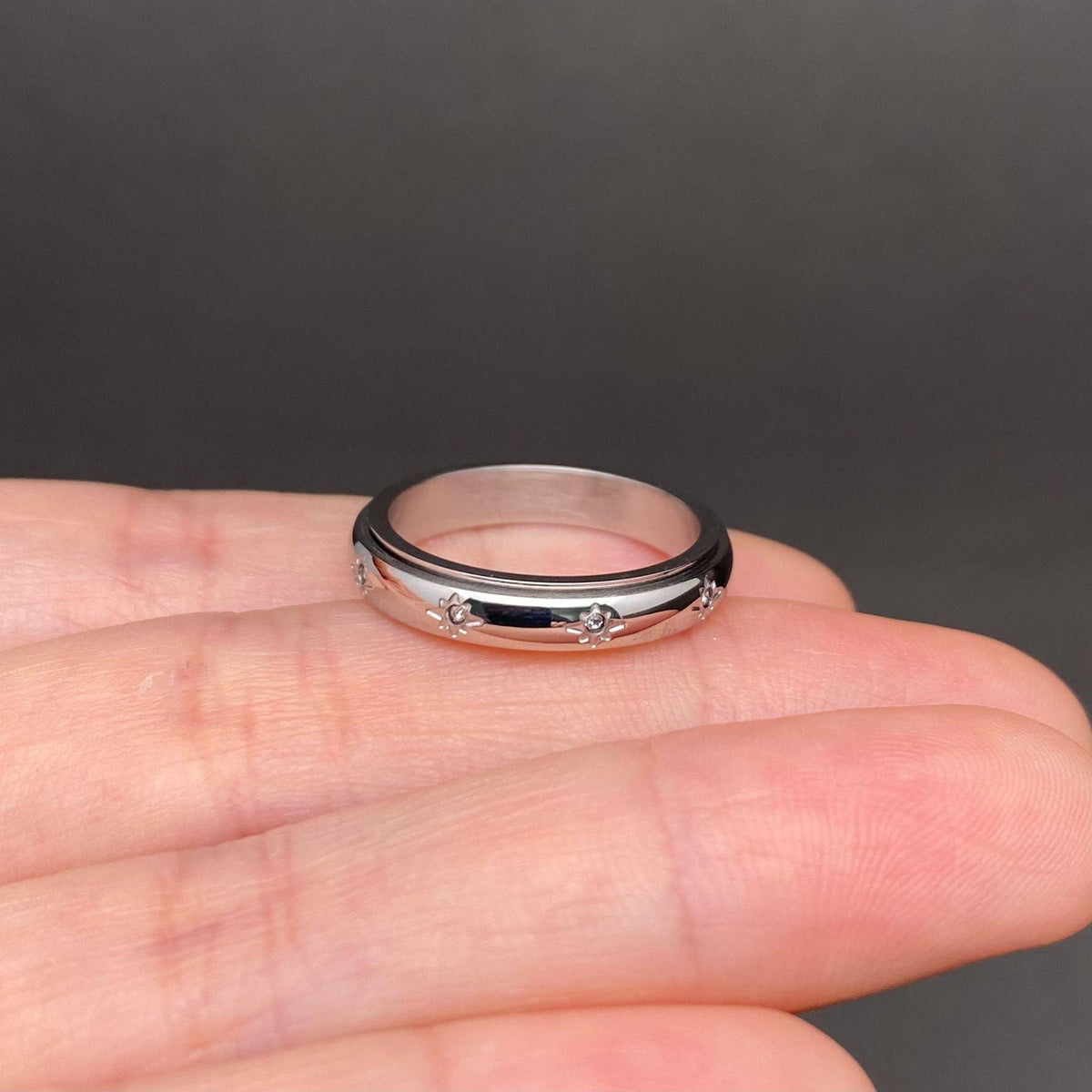 
                  
                    Inlaid Stars Spinner Ring
                  
                