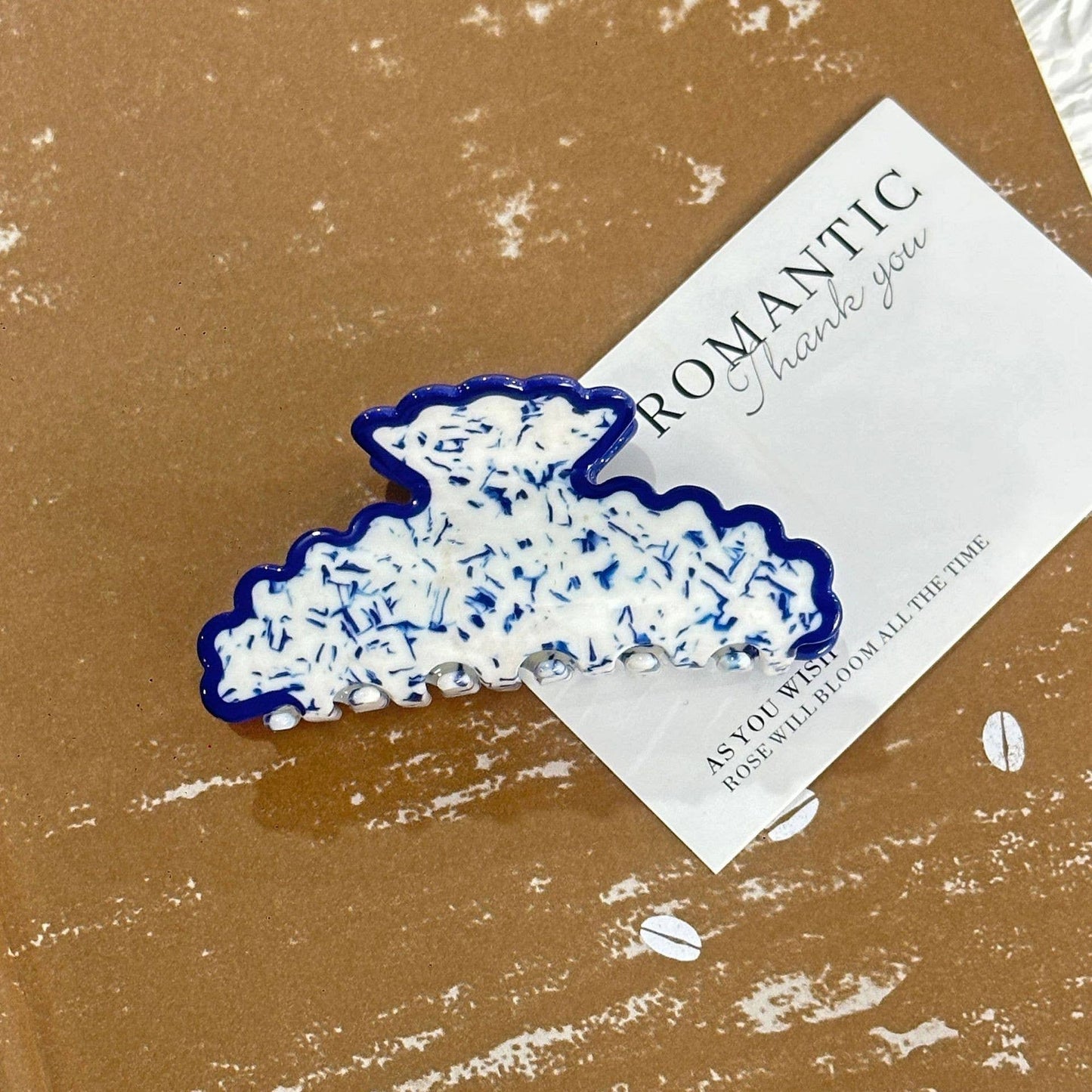 
                  
                    Scalloped Terrazzo Claw
                  
                