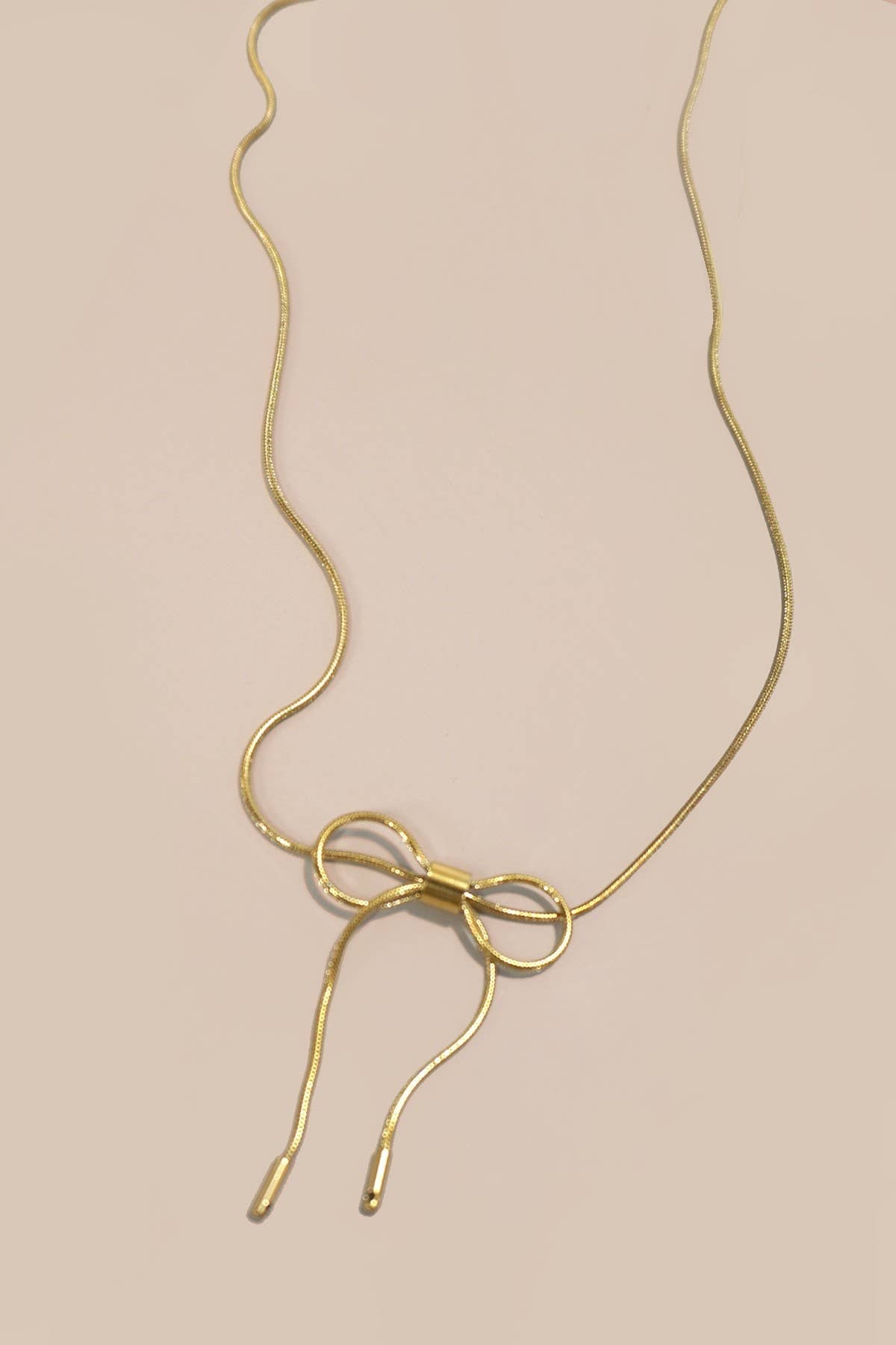 
                  
                    Gold Bow Cable Necklace
                  
                