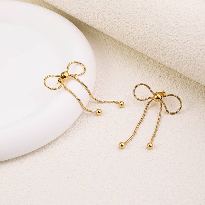 
                  
                    Silver Bow Movement Earrings
                  
                