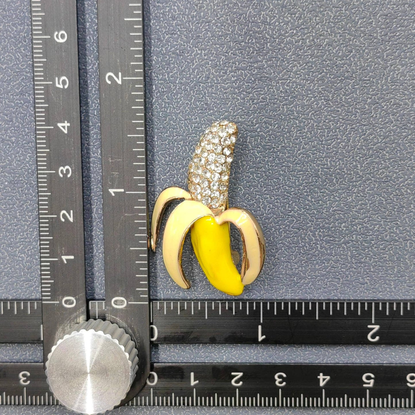 
                  
                    Studded Enamel Half Skinned Banana Brooch
                  
                