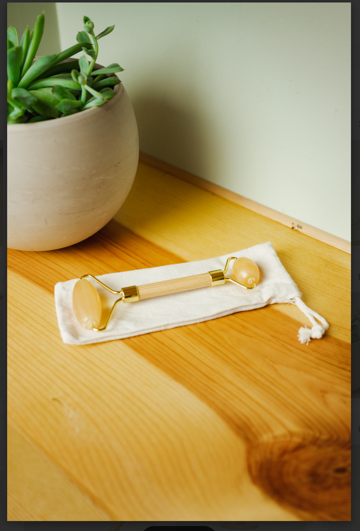 
                  
                    Stone + Bamboo Facial Massage Roller
                  
                