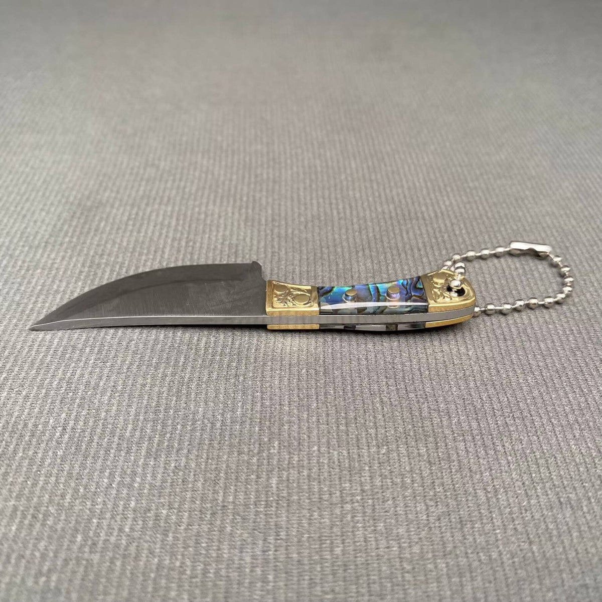 
                  
                    Mini Knife with Protective Sheath
                  
                