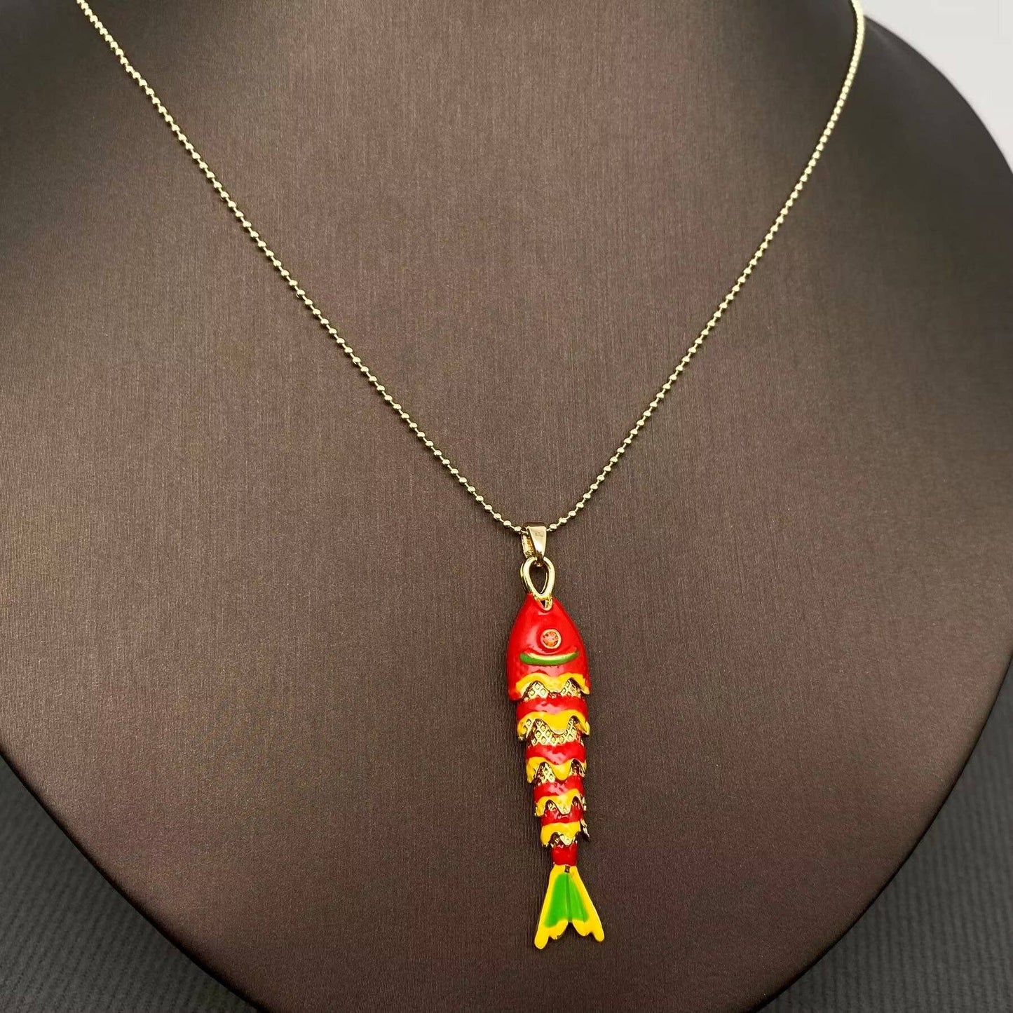 
                  
                    Enamel Wiggle Fish Necklace
                  
                