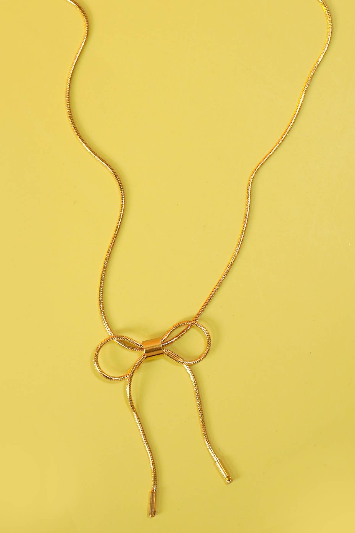 
                  
                    Gold Bow Cable Necklace
                  
                