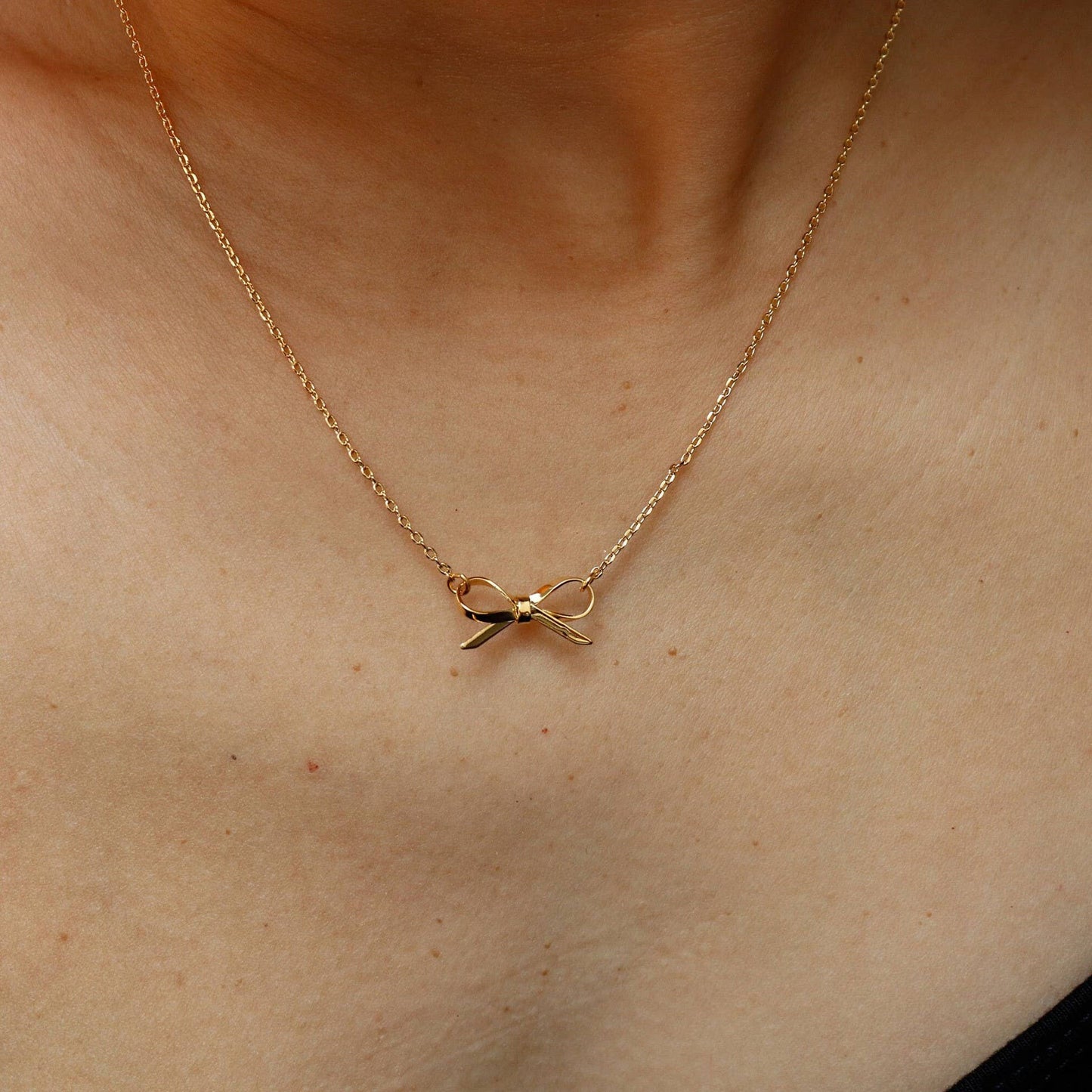 
                  
                    Delicate Gold Bow Necklace
                  
                