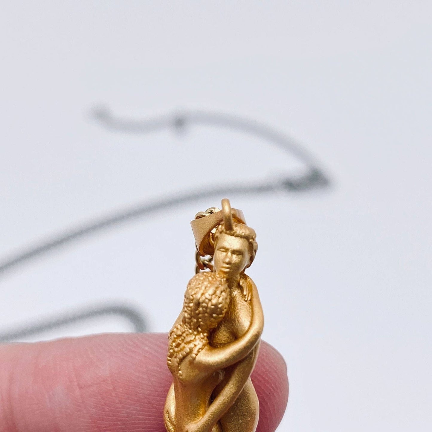 
                  
                    Embracing Lovers Charm Necklace
                  
                