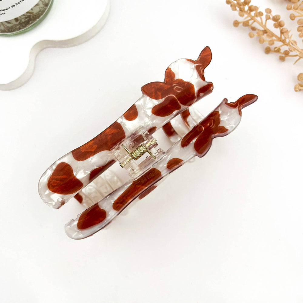 
                  
                    Brown and White Cow Claw
                  
                