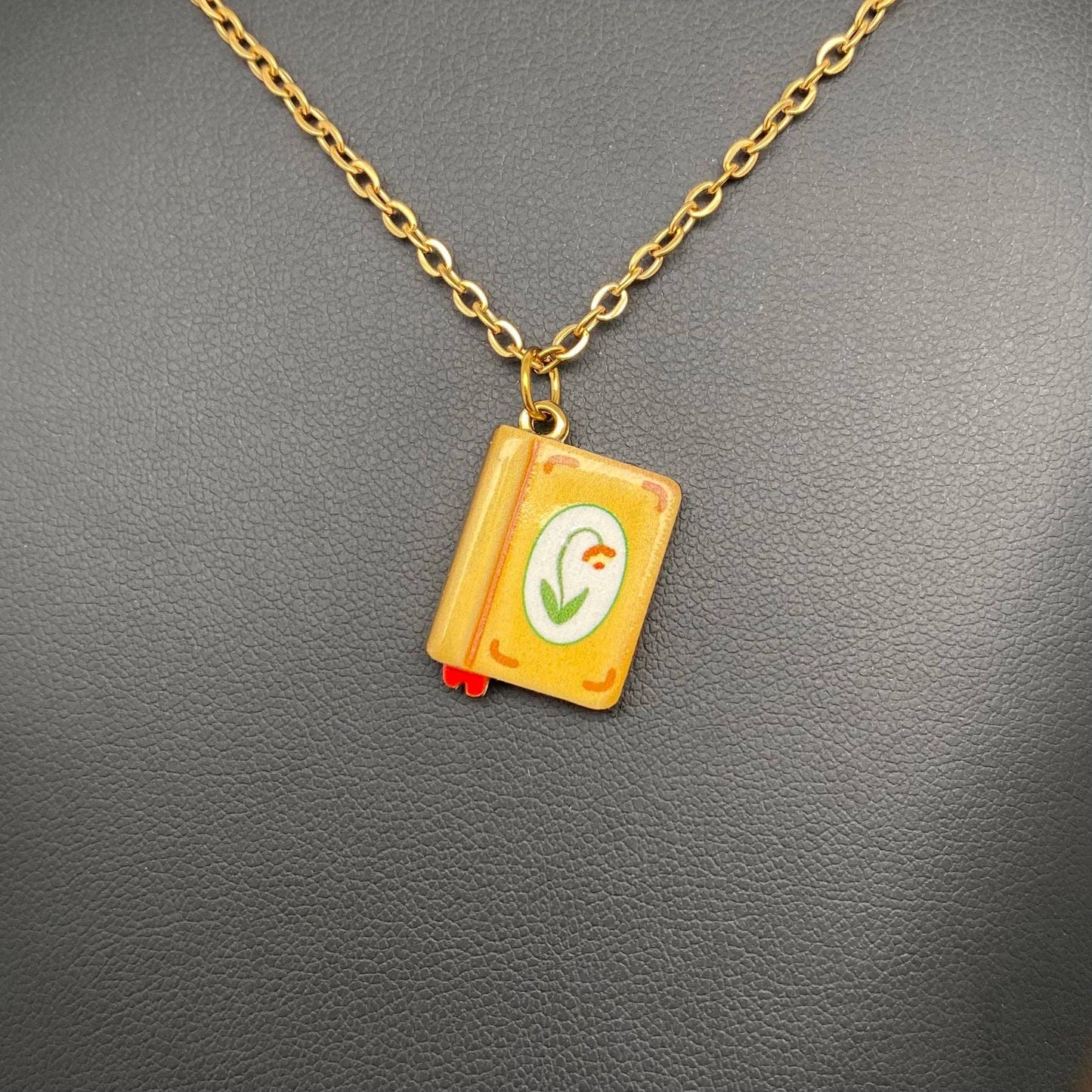 
                  
                    Enamel Book Charm Necklace
                  
                