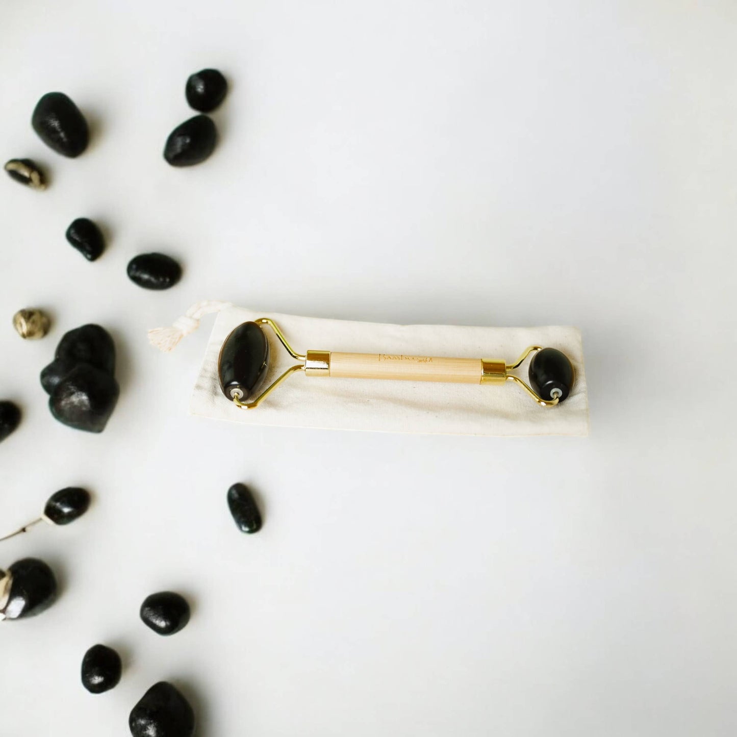 
                  
                    Stone + Bamboo Facial Massage Roller
                  
                