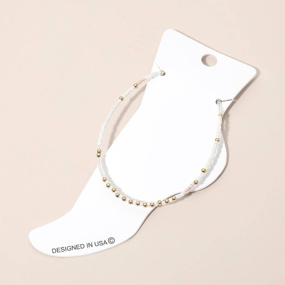 
                  
                    White + Gold Seed Beaded Petite Anklet
                  
                