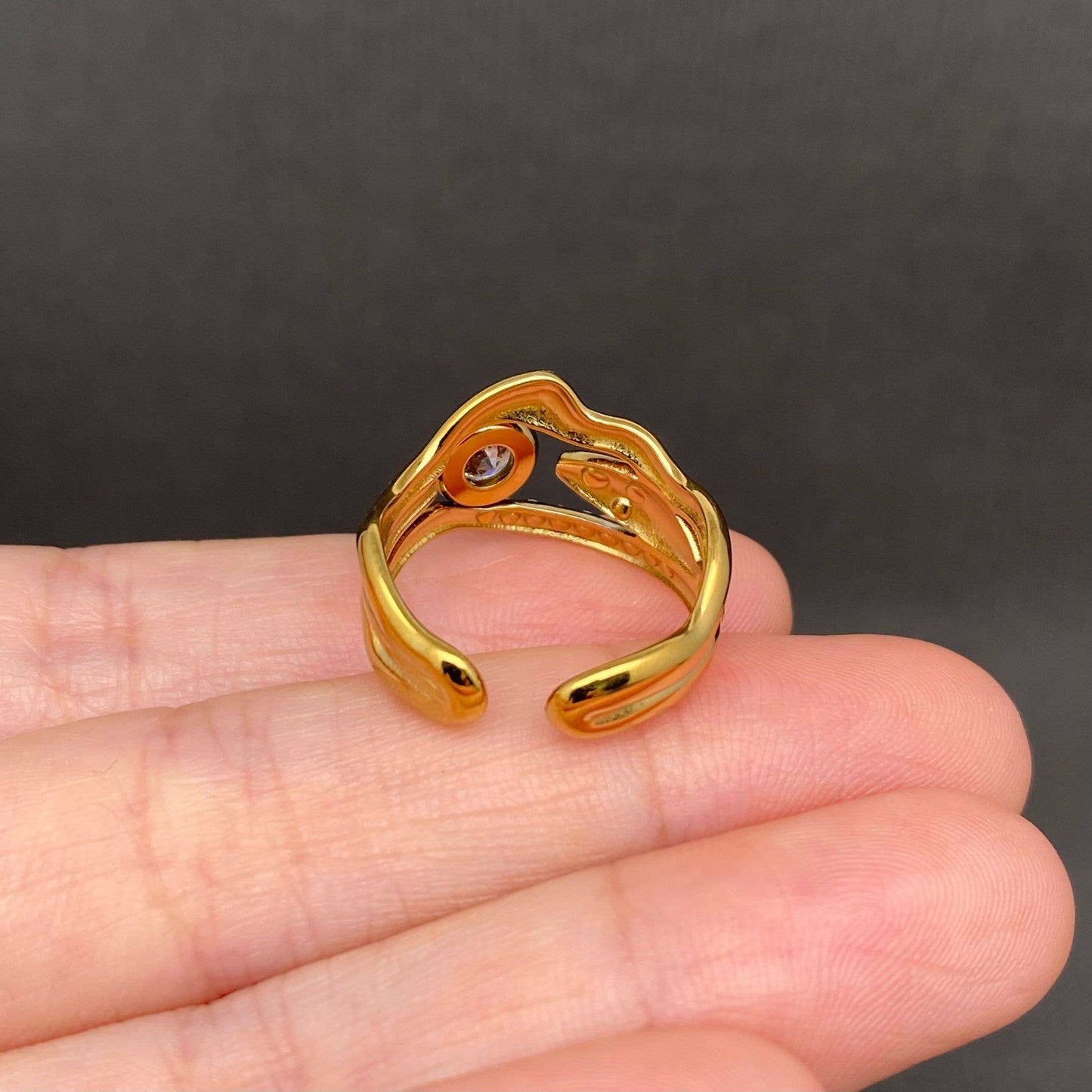 
                  
                    Zircon Inlaid Squiggly Fish Ring
                  
                