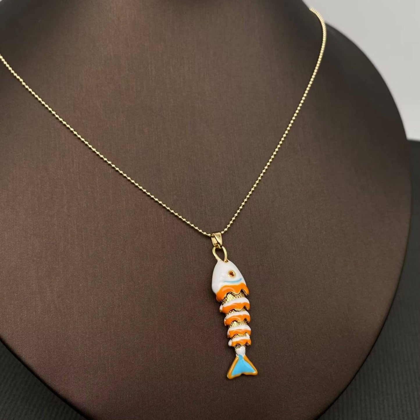 
                  
                    Enamel Wiggle Fish Necklace
                  
                