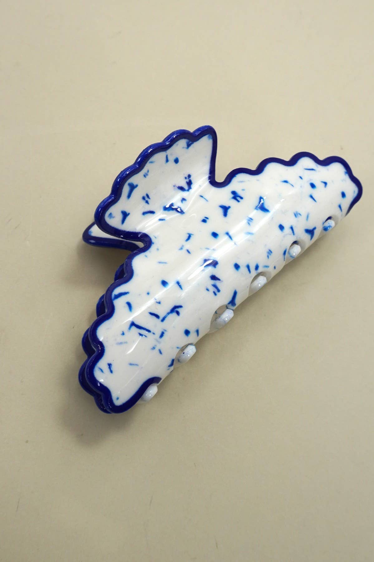 
                  
                    Scalloped Terrazzo Claw
                  
                