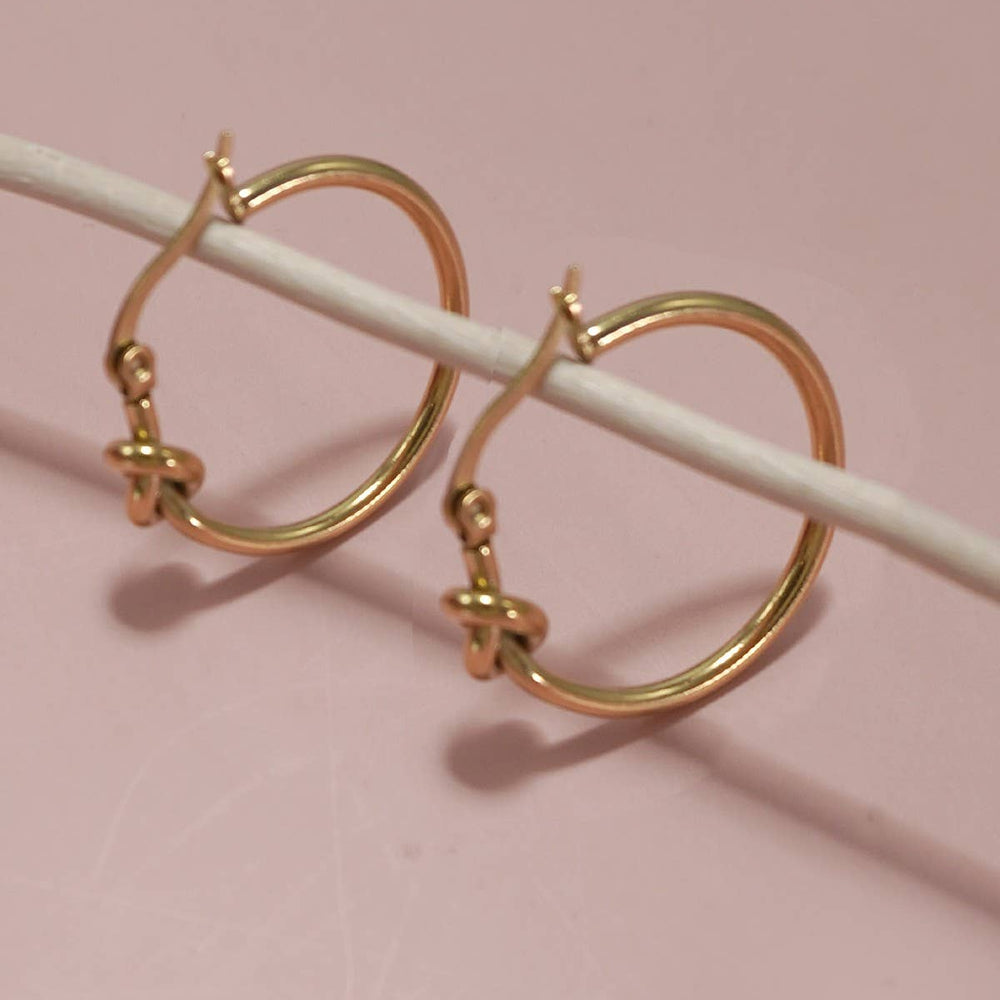 
                  
                    Gold Knot Cuff Earrings
                  
                
