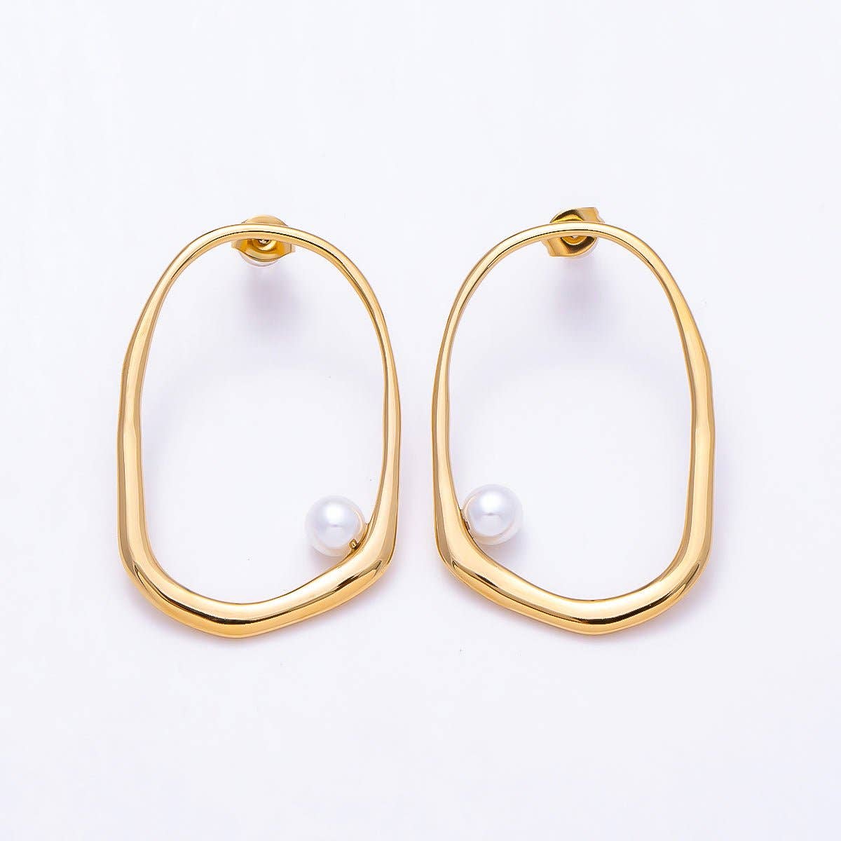 
                  
                    Organic Oblong Cradled Pearl Earrings
                  
                