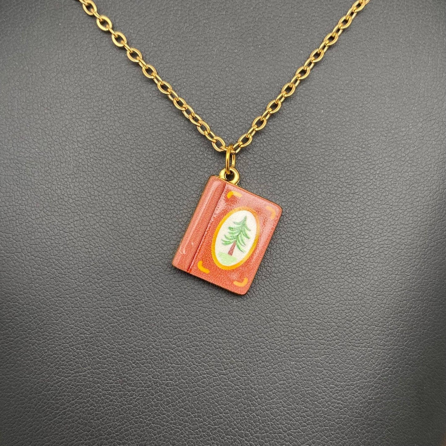 
                  
                    Enamel Book Charm Necklace
                  
                