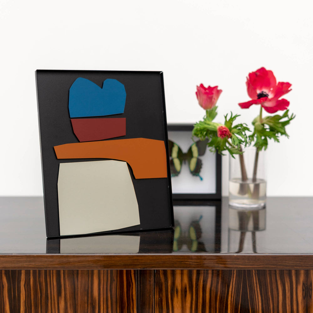 
                  
                    A magnetic metal Matisse inspired rearrangeable composition piece of art, setting on a table
                  
                