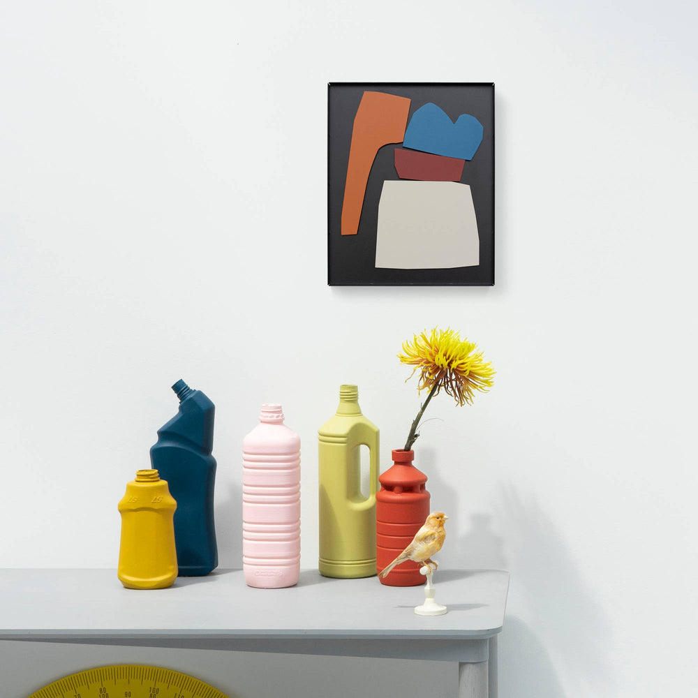 A magnetic metal Matisse inspired rearrangeable composition piece of art displayed on a wall