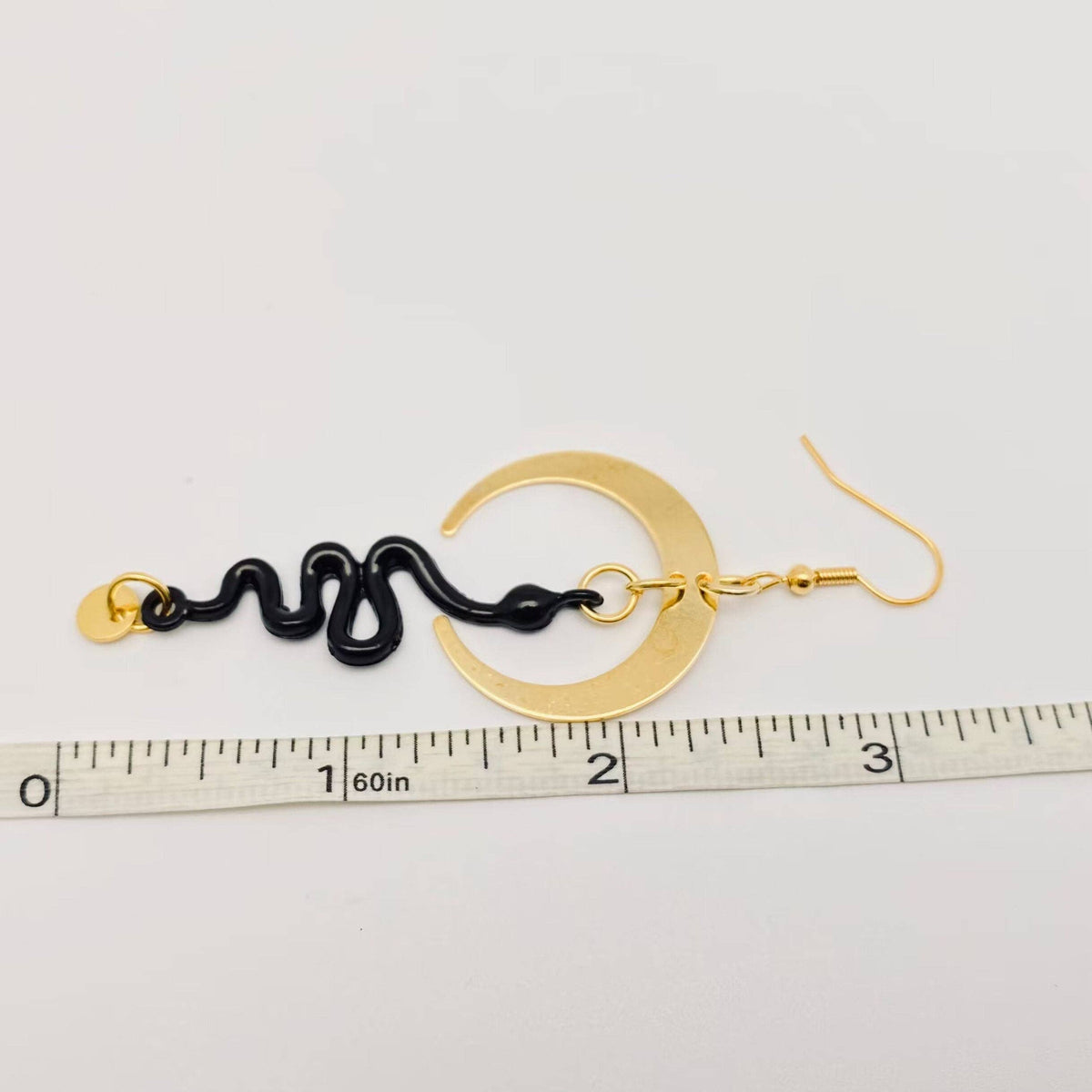 
                  
                    Nocterra Snake Earrings
                  
                