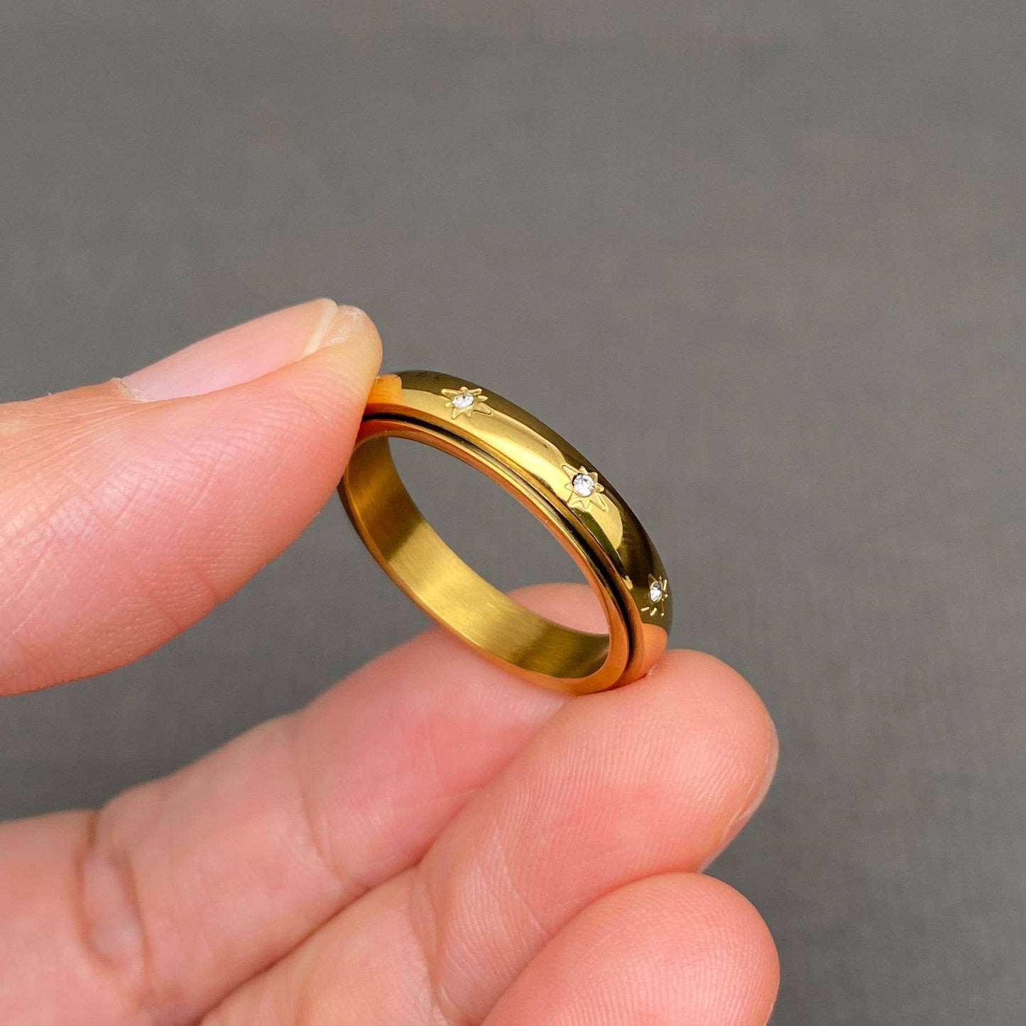 
                  
                    Inlaid Stars Spinner Ring
                  
                