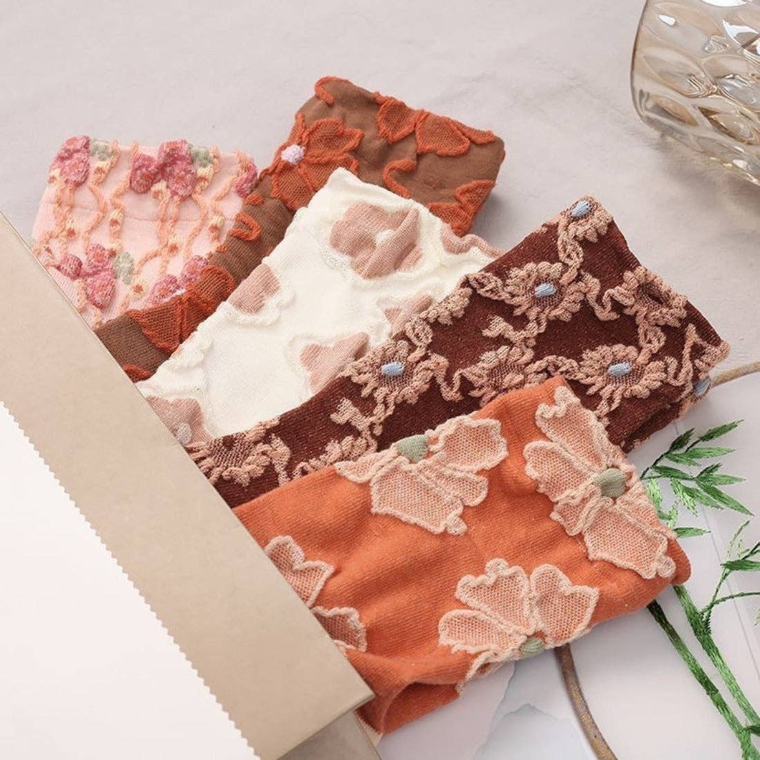 
                  
                    Embossed Women's Socks - Orange Florals
                  
                